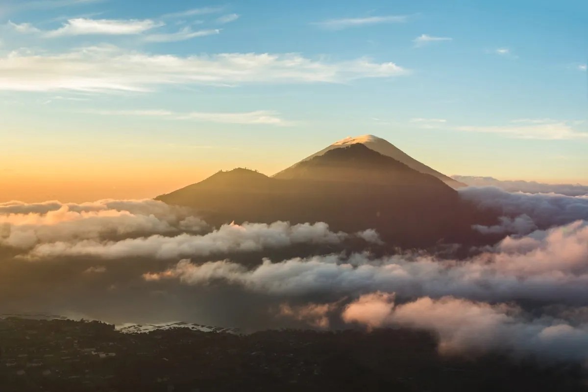 4x4 custom jeep conquering the rugged black lava field terrain of Mount Batur Kintamani